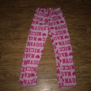 Pink pajama pants that say laugh in them